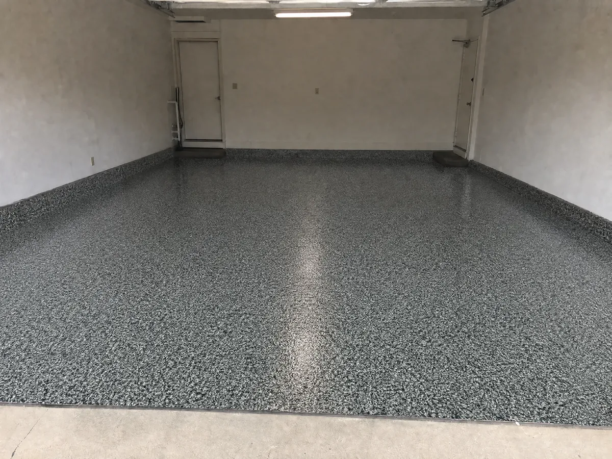 Same garage visualized with a decorative flake coating